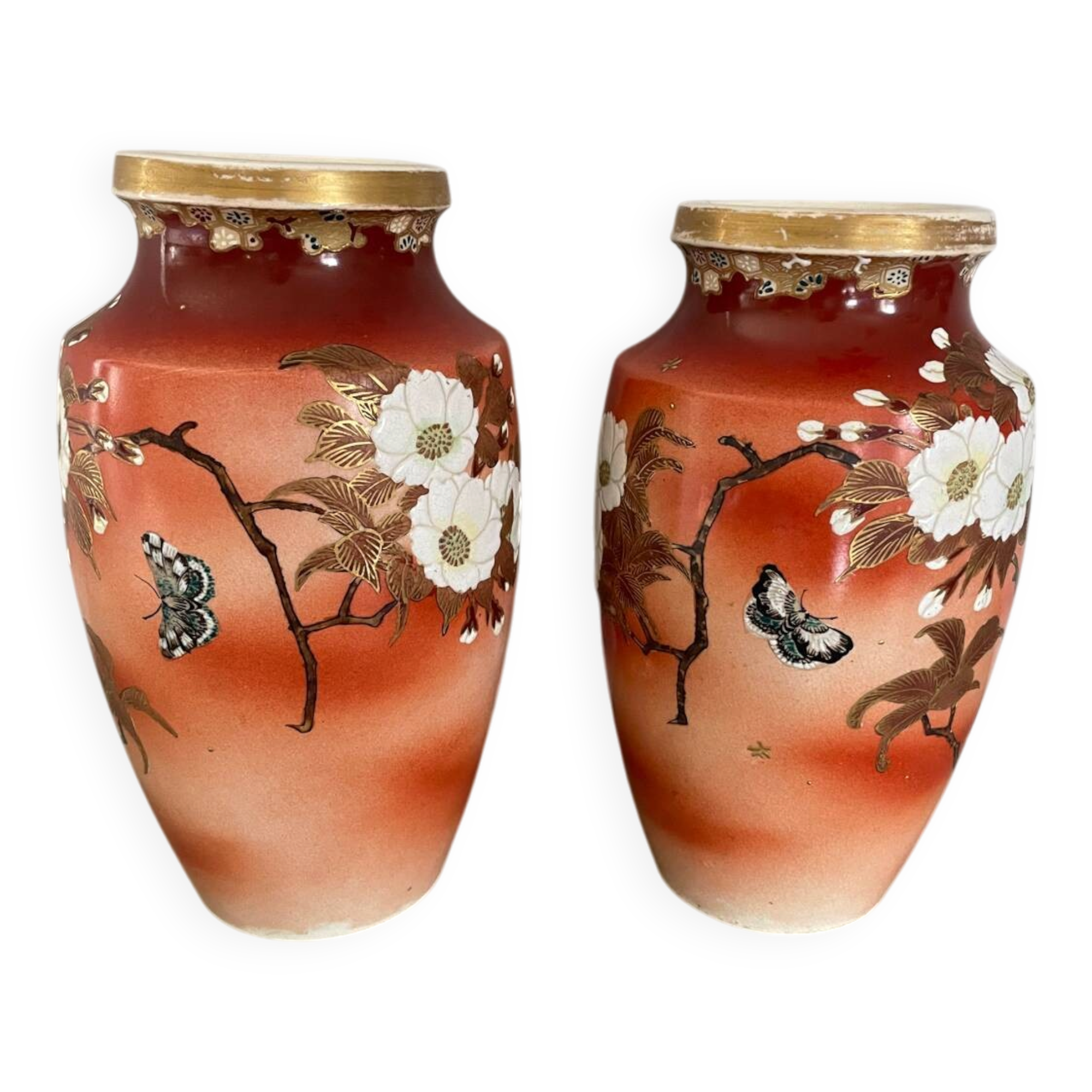 Pair of antique vases with butterfly and flower motif.