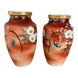 Pair of antique vases with butterfly and flower motif.