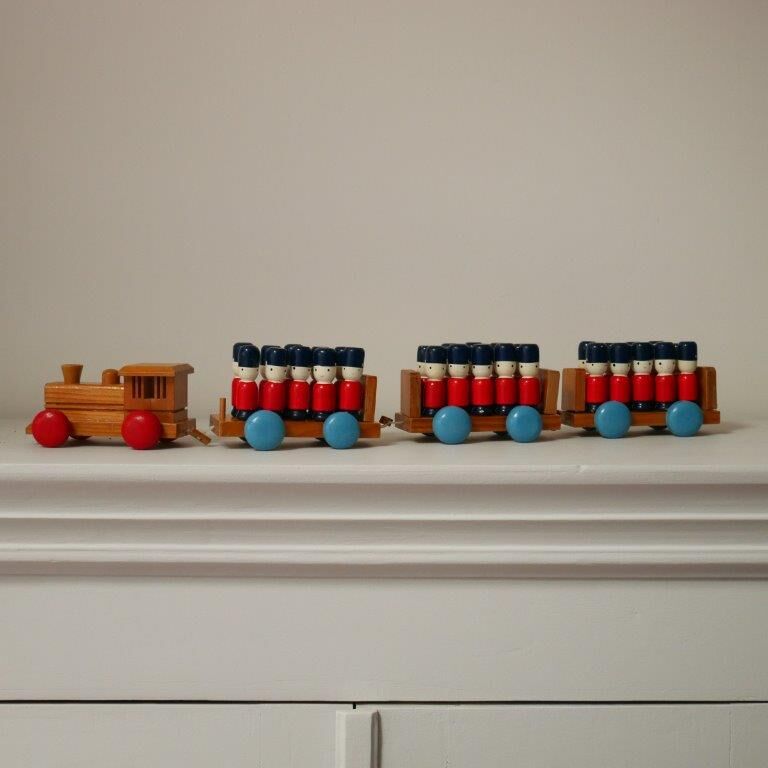 Wooden train with soldiers