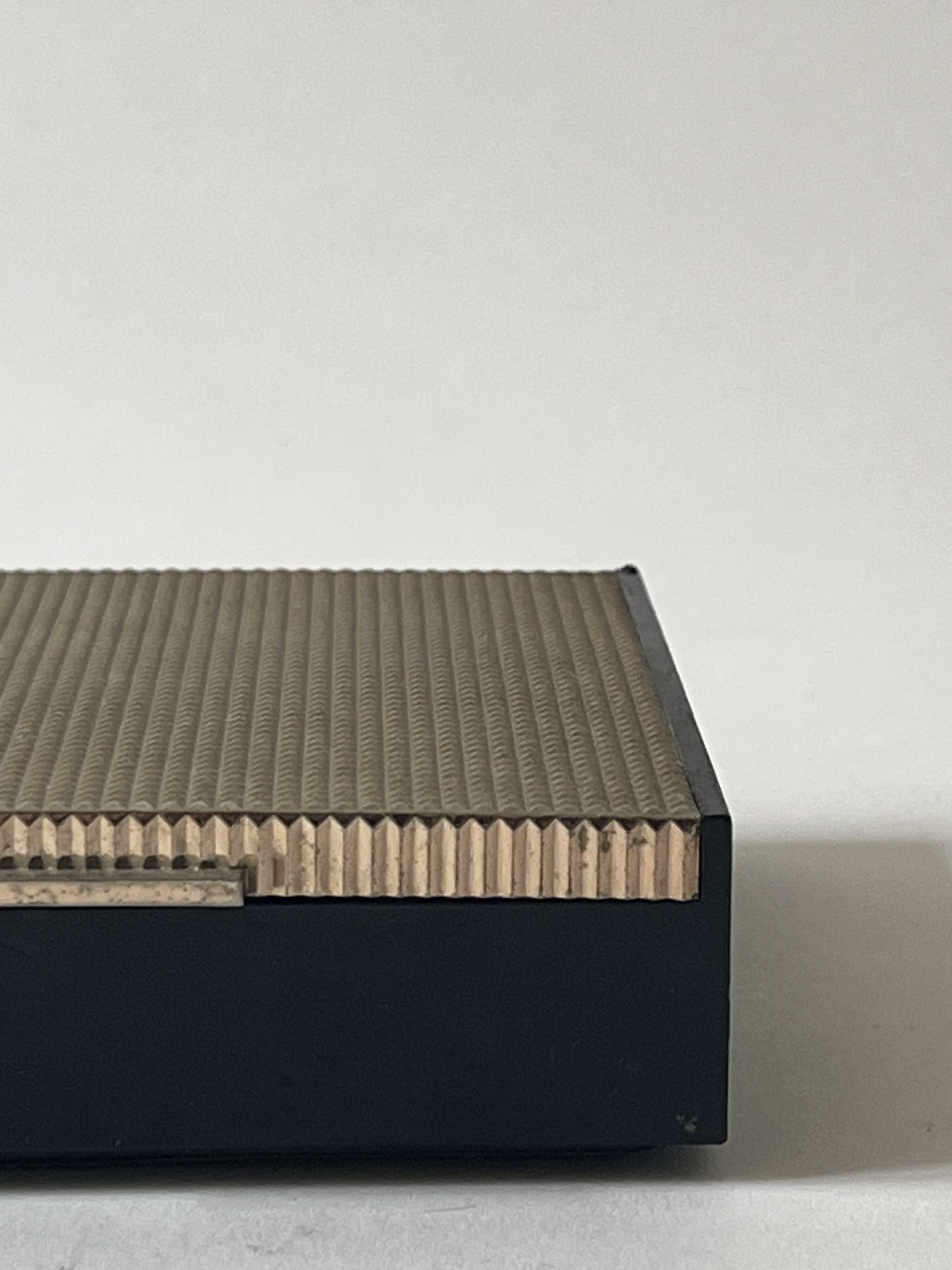 Bakelite and brass pocket emptier, 1970s design