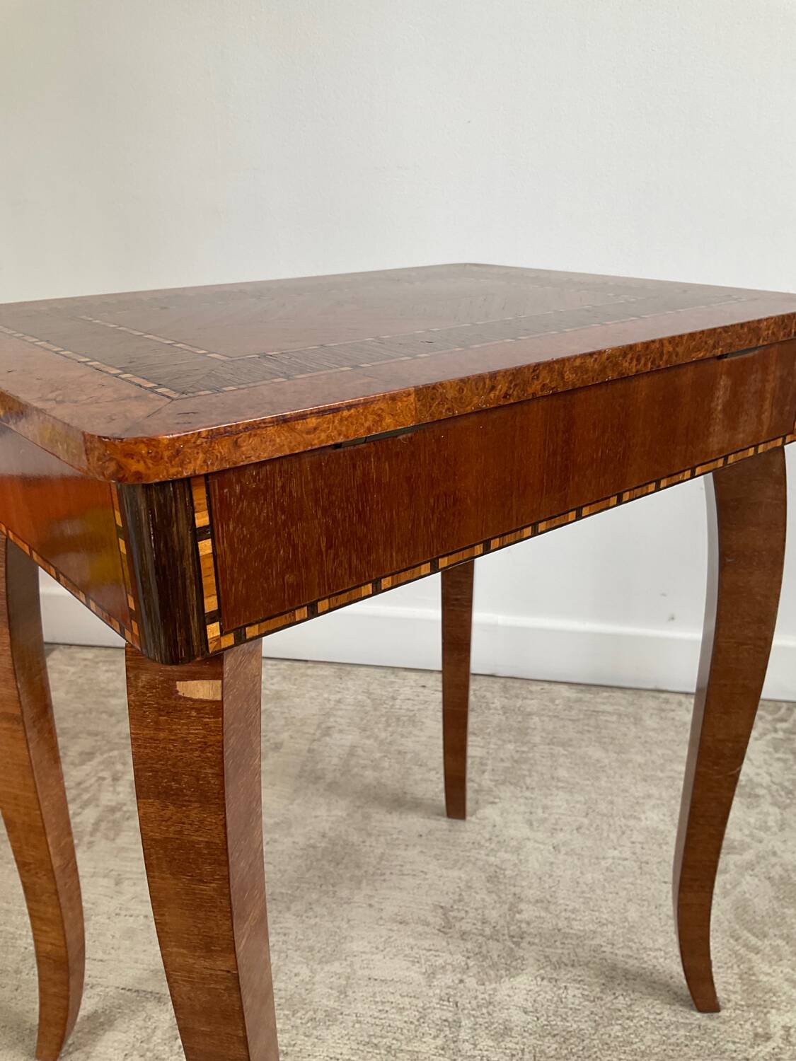 Small marquetry pedestal table with key storage