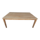 Large natural wood table with rectangular top supported by legs