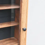 Antique wall display cabinet in natural wood and black – small glass-fronted collector's piece.