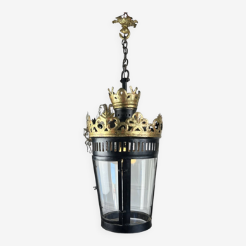 Large iron lantern in the shape of an inverted cone with gilded crown with gold leaf