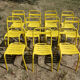 Lot of 11 yellow metallic bistro chairs from the 1950s