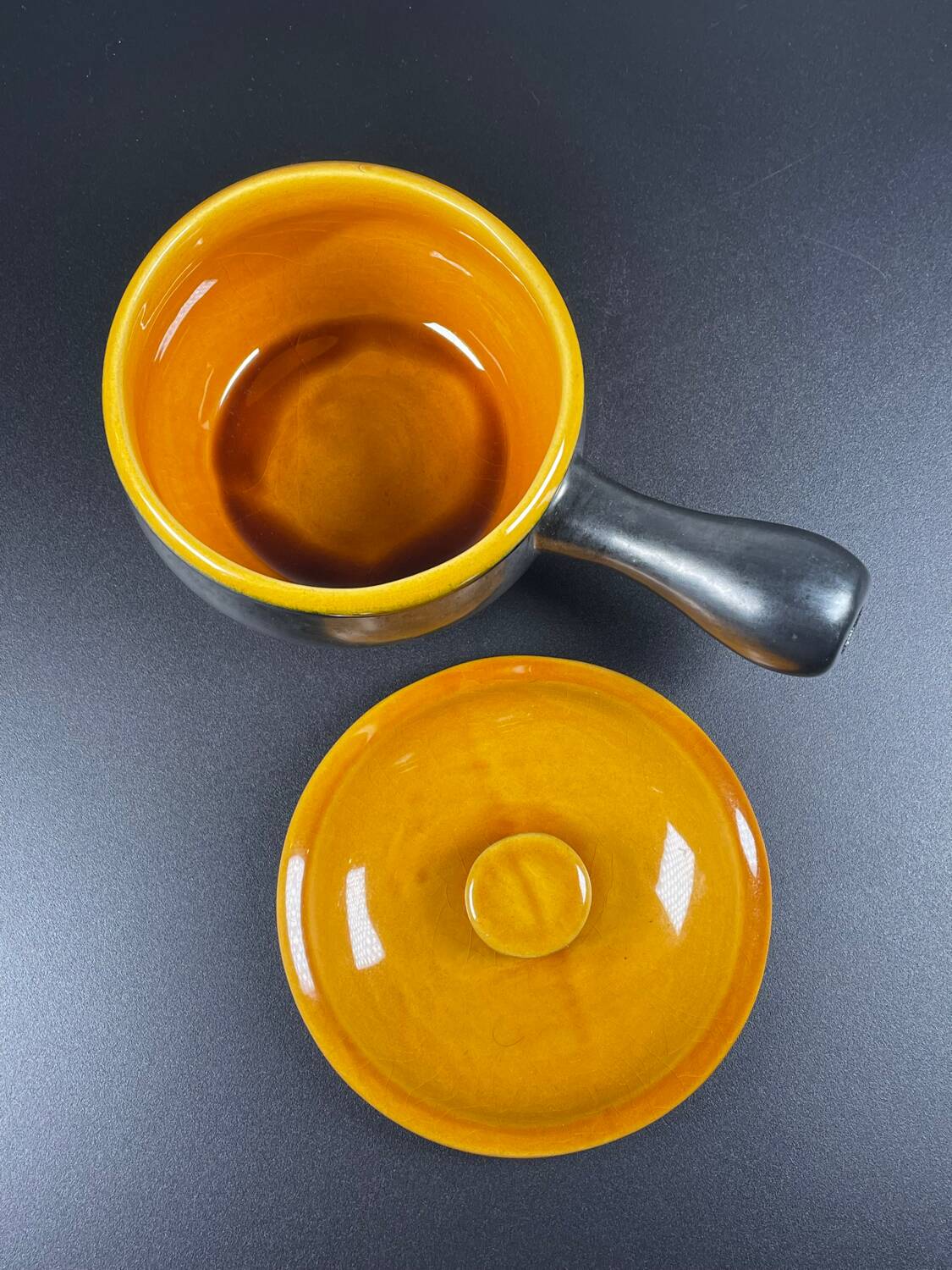 Black and yellow fondue pot