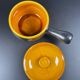 Black and yellow fondue pot