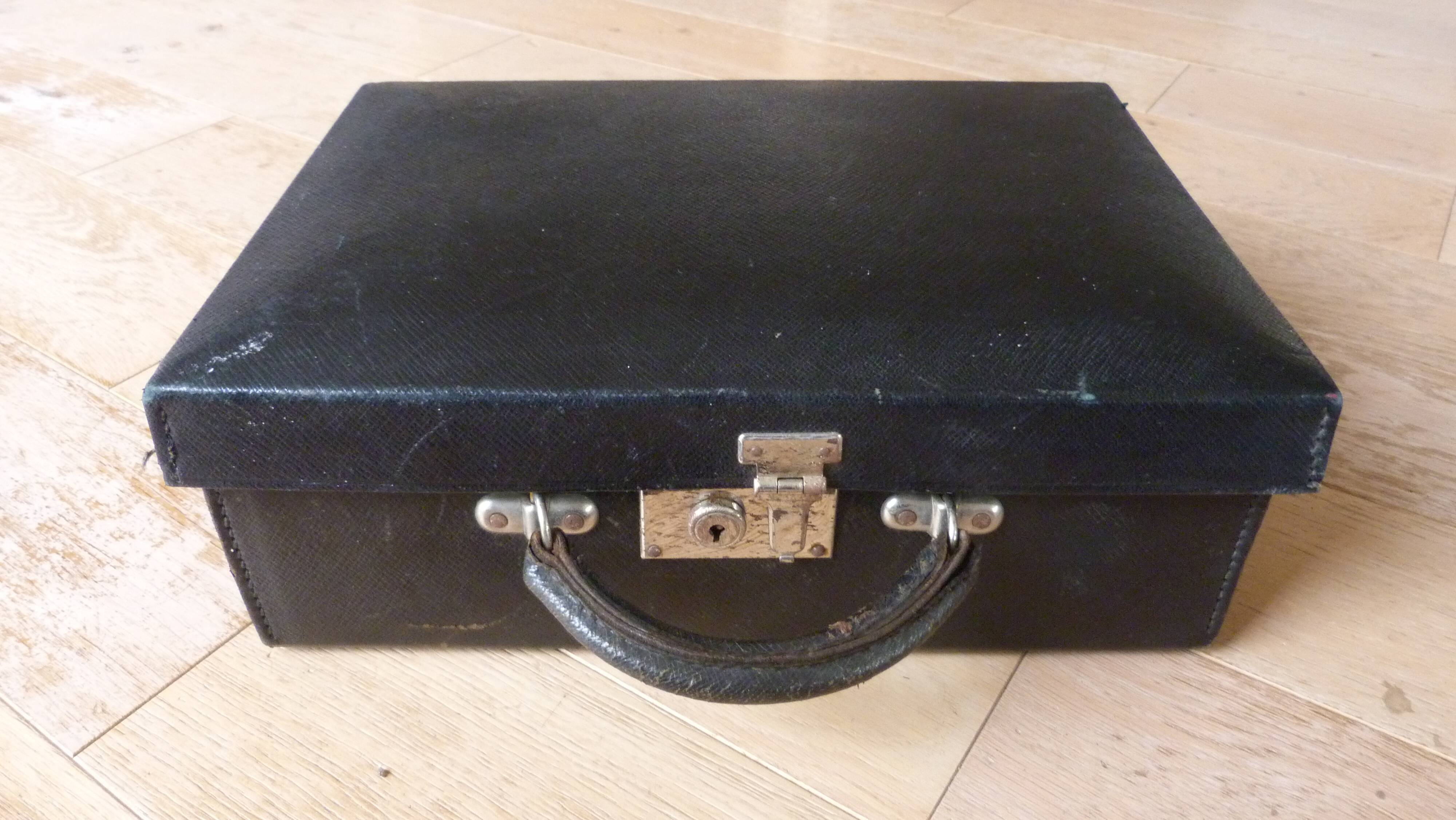 Old black suitcase