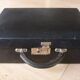 Old black suitcase