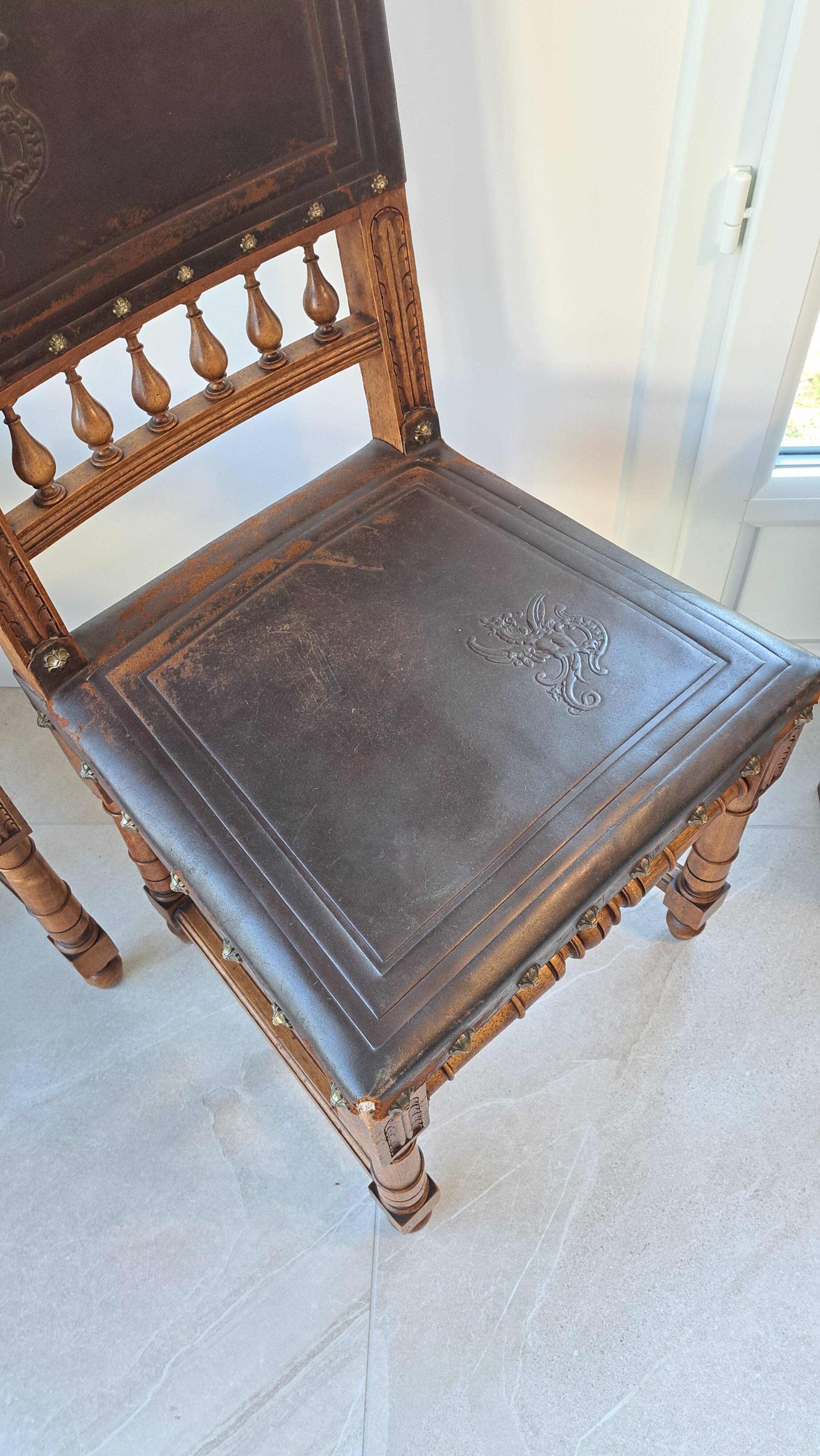 Pair of antique chairs in embossed leather, Henri II style.