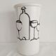 Vase with a relief design of bottles and glasses