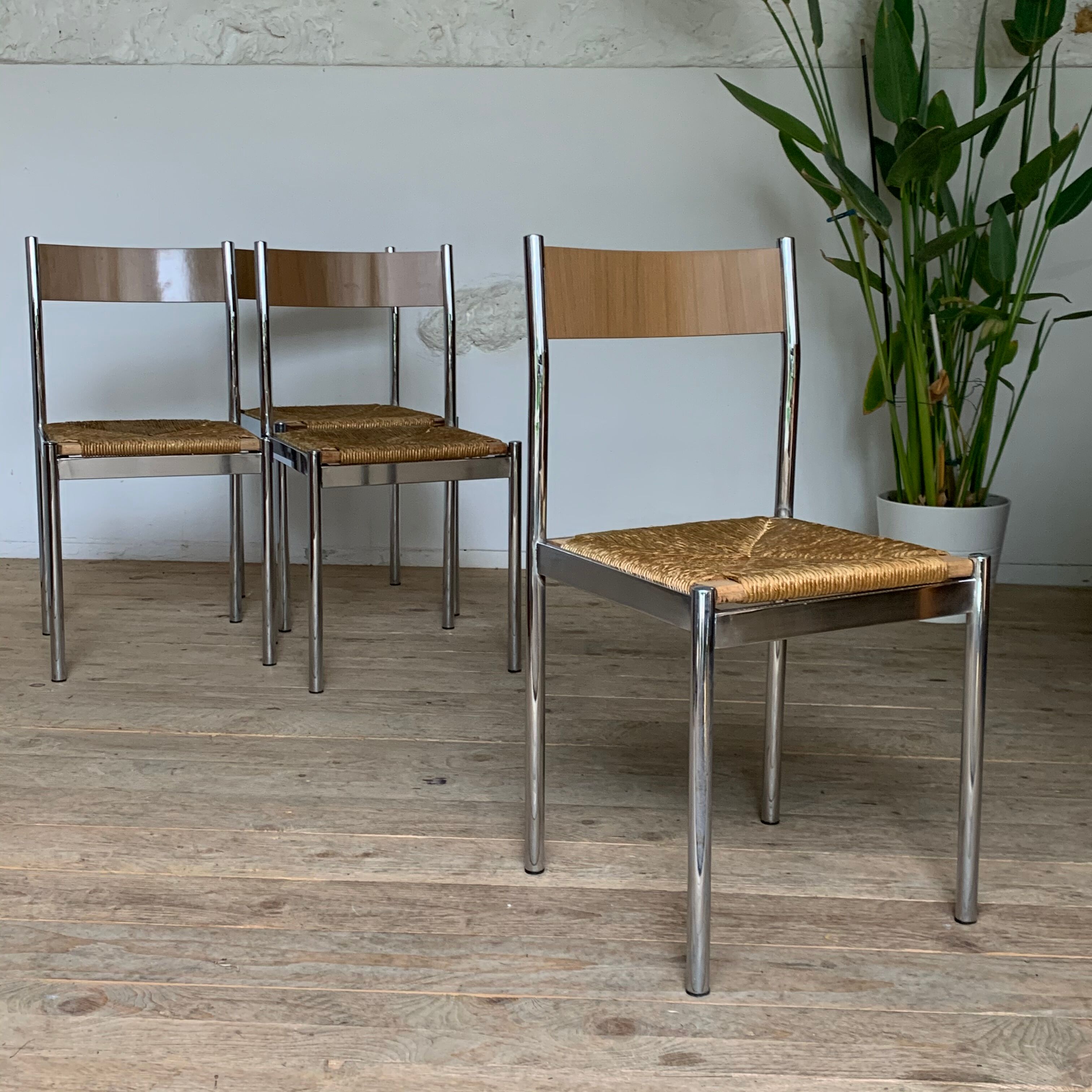 4 chrome and straw chairs