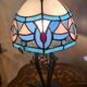 antique wrought iron lamp, 1900 to 1930 with stained glass lampshade soldered with lead