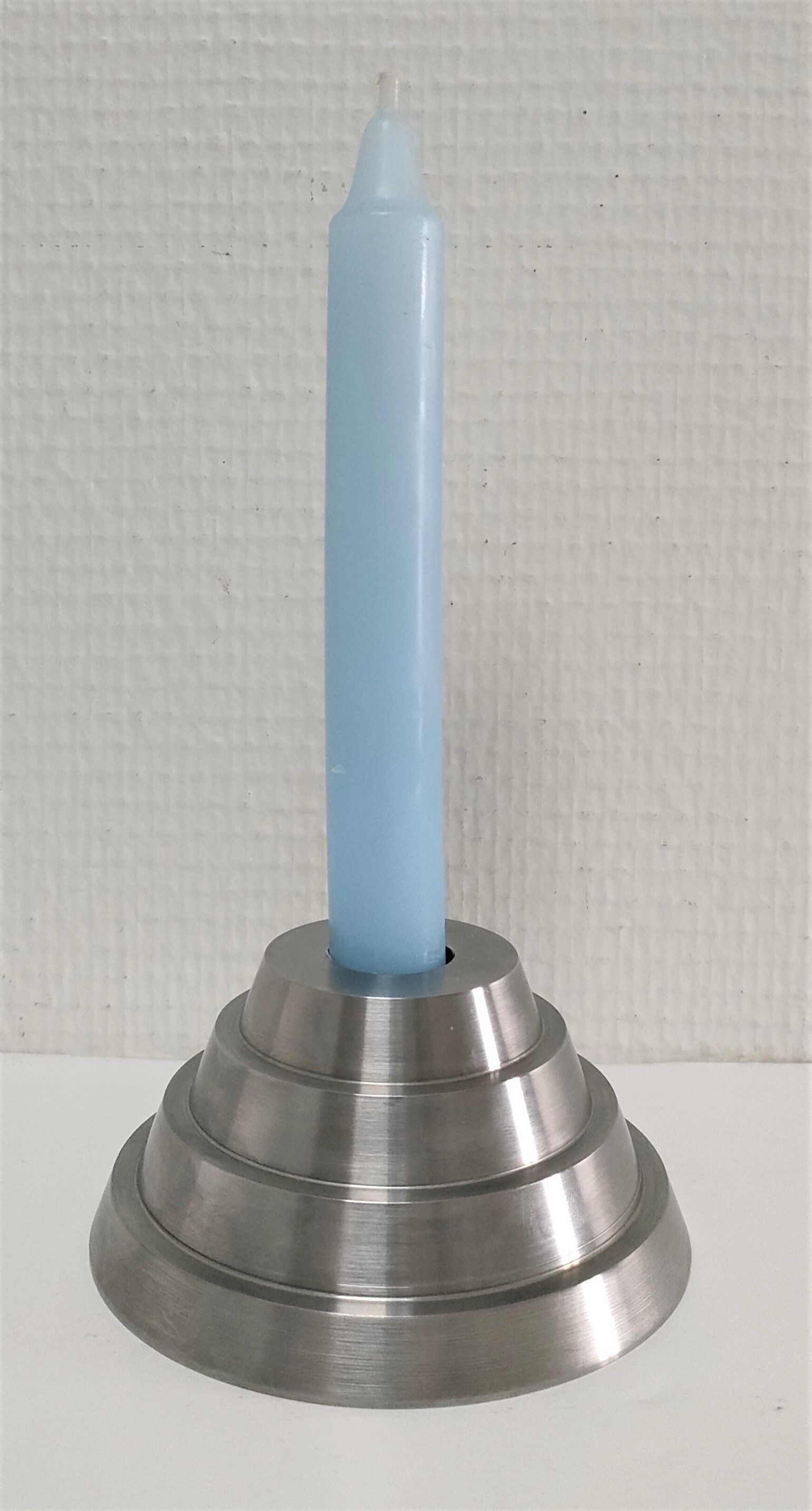 Solid steel candle holder turned design