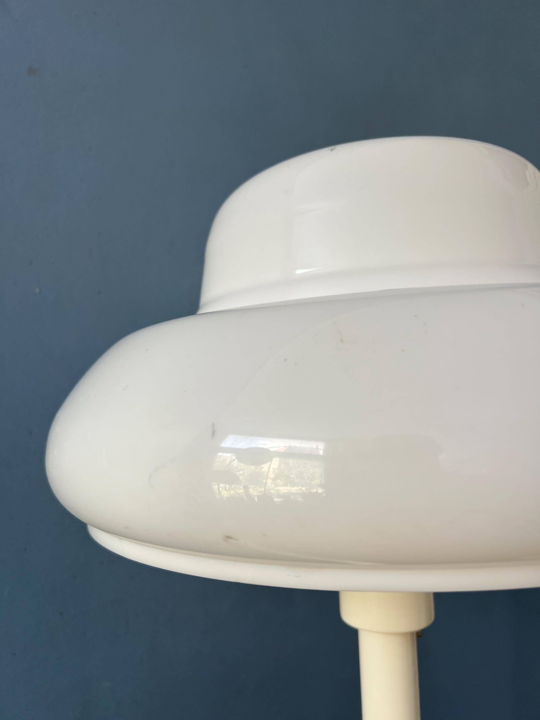 Mid-century mushroom floor lamp with a white plexiglass shade.
