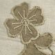 Cushion in vintage fabric with ornamentation.