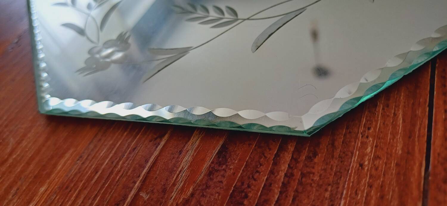 Beveled mirror with floral decor