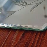 Beveled mirror with floral decor