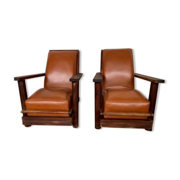 Paire de fauteuils brutalistes en teck et cuir cognac vintage des annees 1950