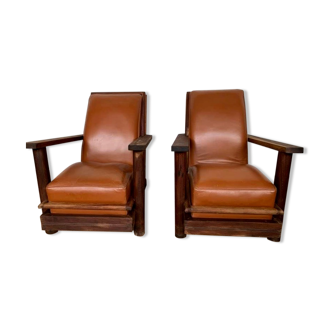 Paire de fauteuils brutalistes en teck et cuir cognac vintage des annees 1950
