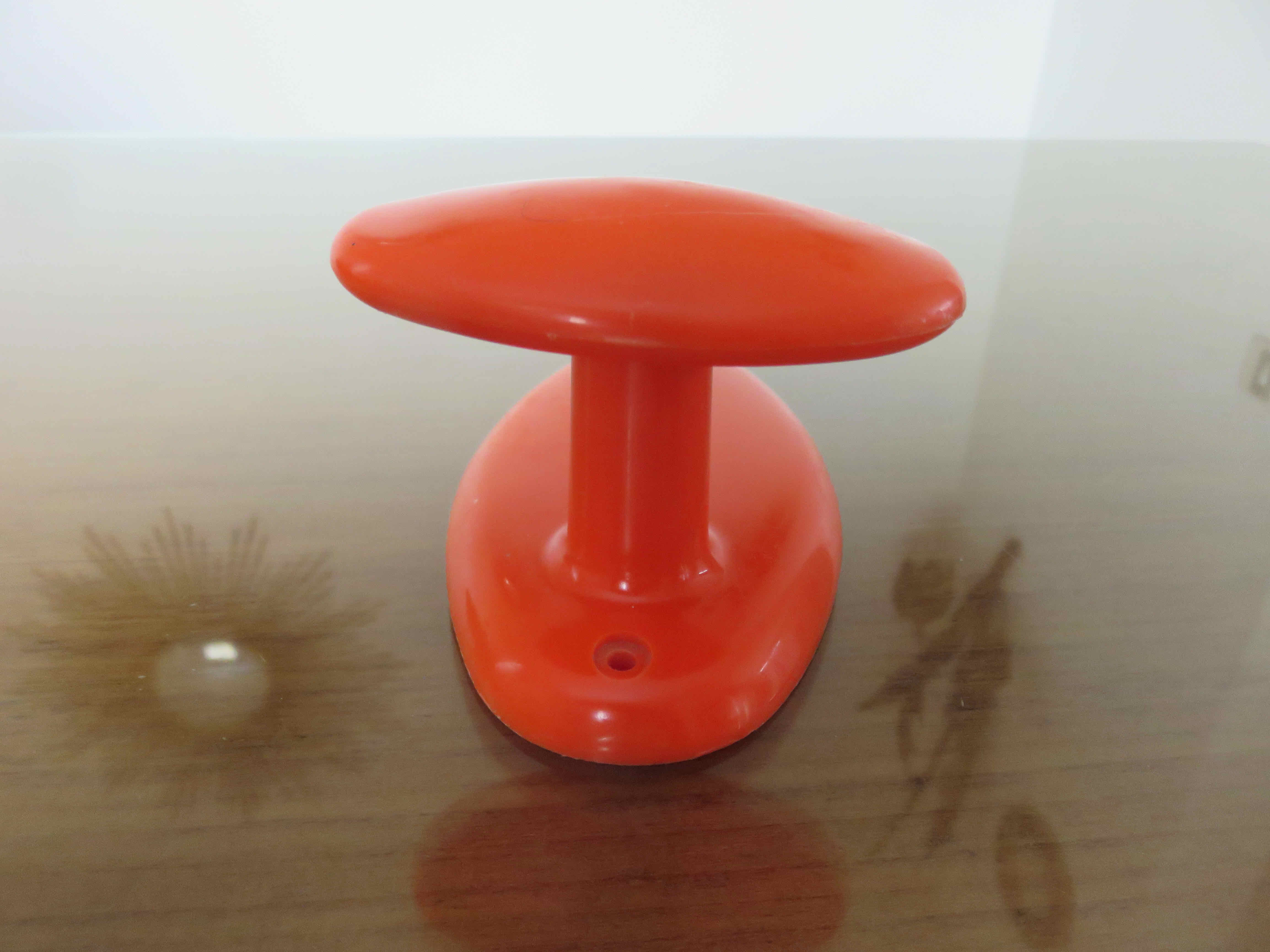 Orange plastic hook 70s