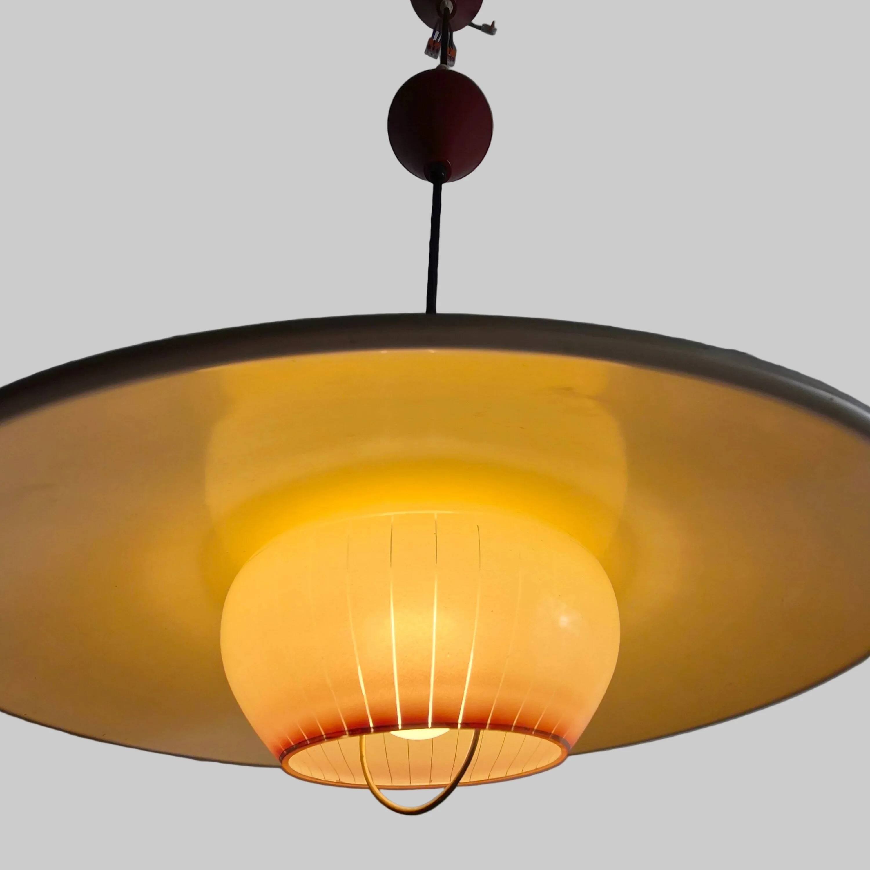 Extensible metal and opaline pendant light, Denmark, 1960.