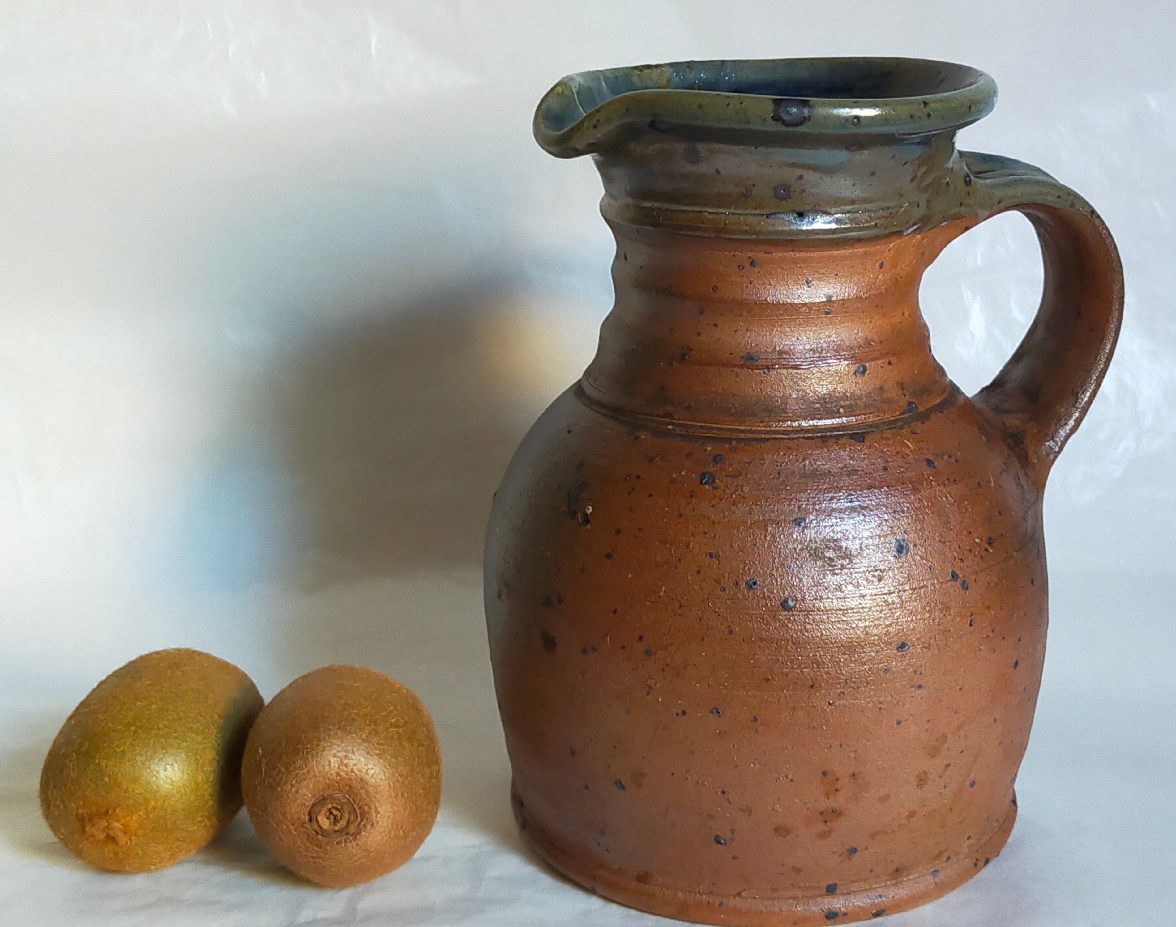 Pitcher traditional pottery Folk art in old enamelled sandstone