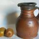 Pitcher traditional pottery Folk art in old enamelled sandstone