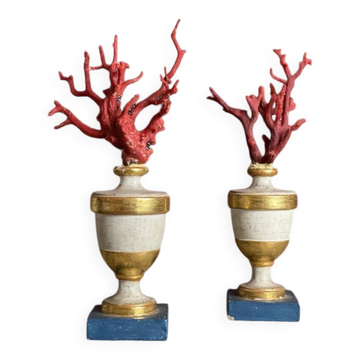 Pair of red corals on gilded and blue wooden bases