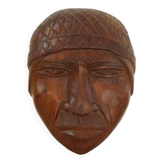 Sculpture visage en bois brut