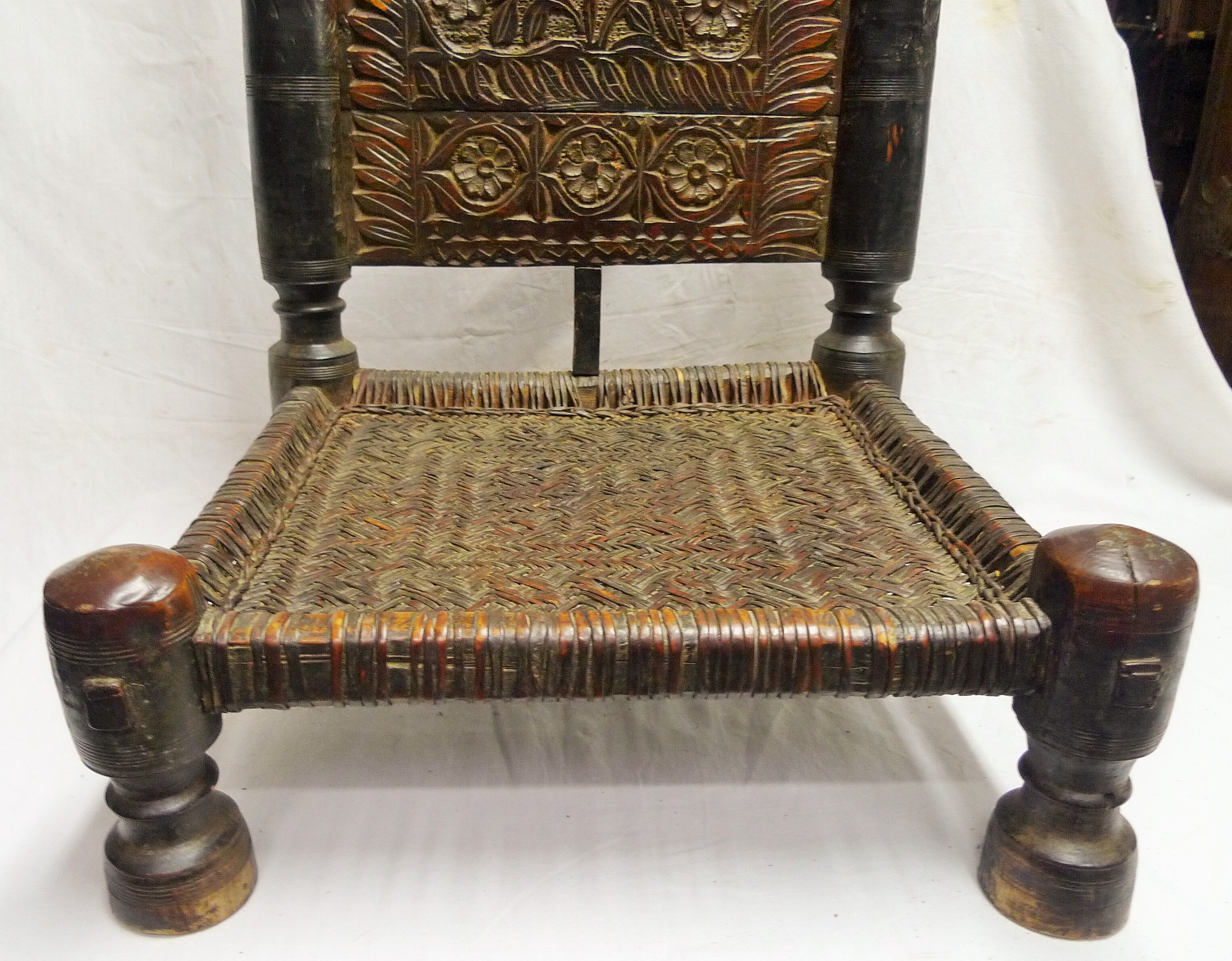 Traditional low chair in wood and leather