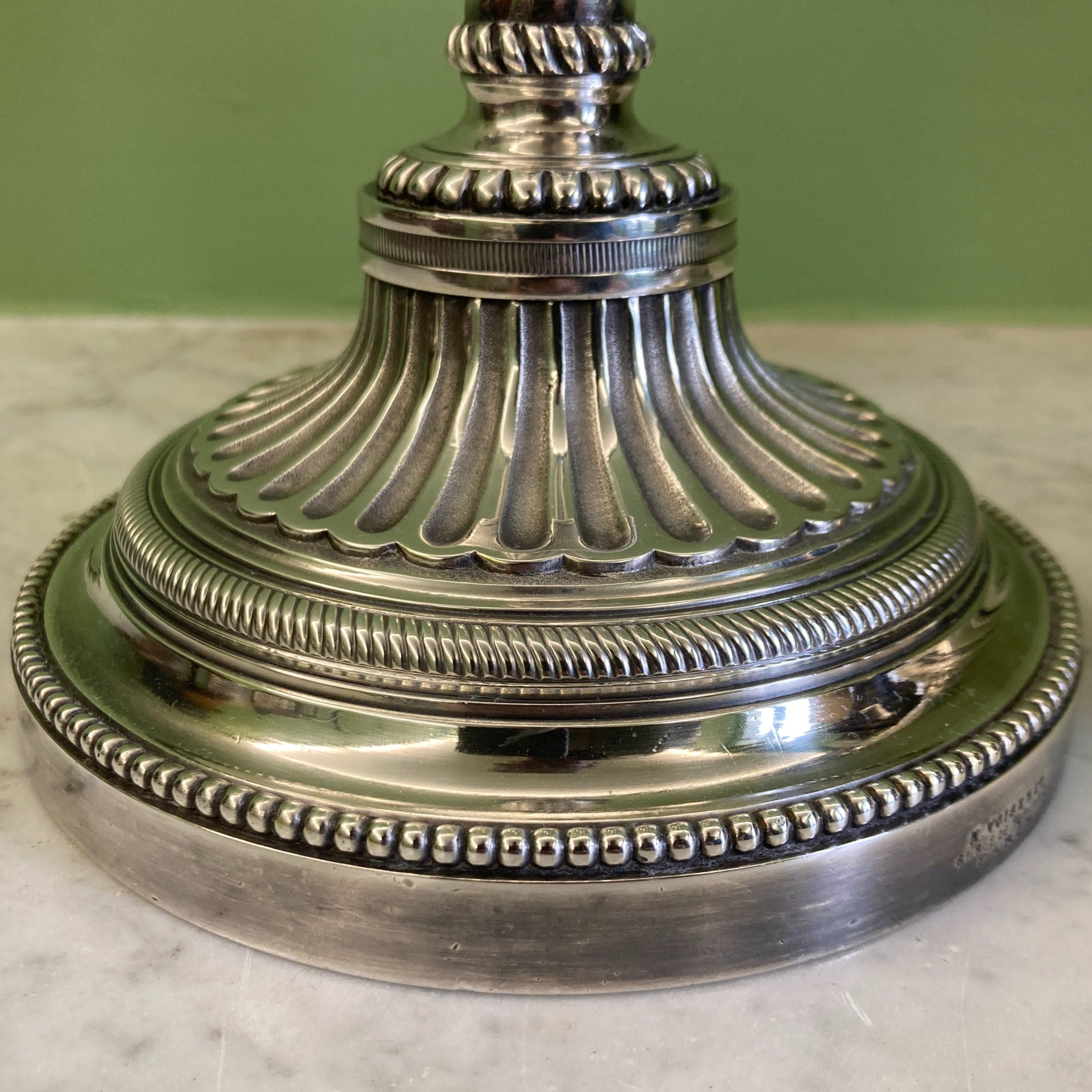 Pair of silvered bronze candlesticks from the 19th century in Louis XVI style signed Voisenet.