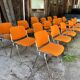 Sérié 39 chaises 4 fauteuils DSC 106 en tissu orange par Giancarlo Piretti pour Castelli