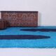 Handmade artisan rug in beige, size 150x250 cm.