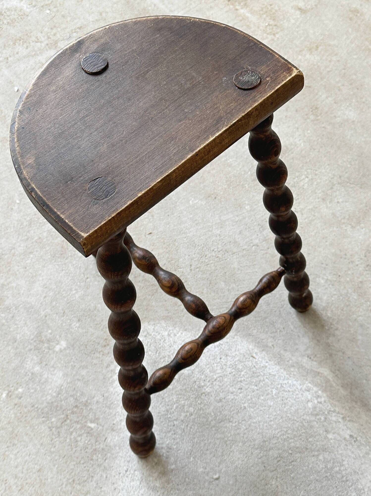 Two French farmhouse stools made of turned wood.