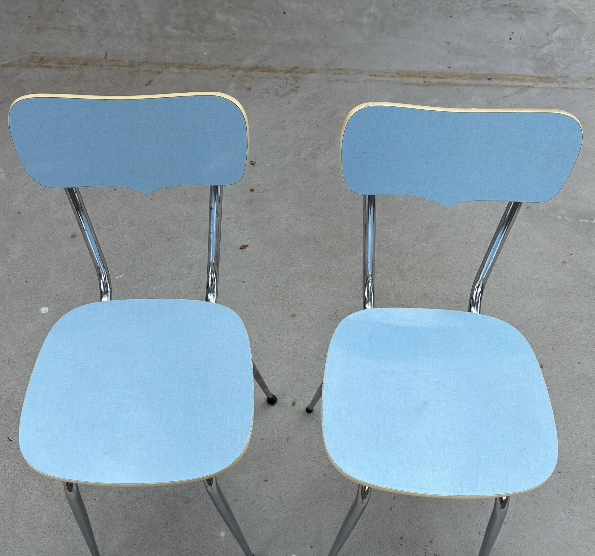 Two blue Formica "Peugeot" chairs.