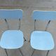 Two blue Formica "Peugeot" chairs.