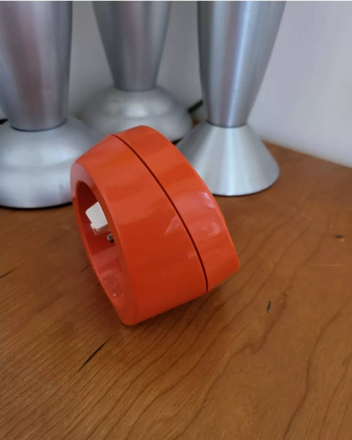 Vintage mechanical alarm clock in orange plastic Uti West Germany