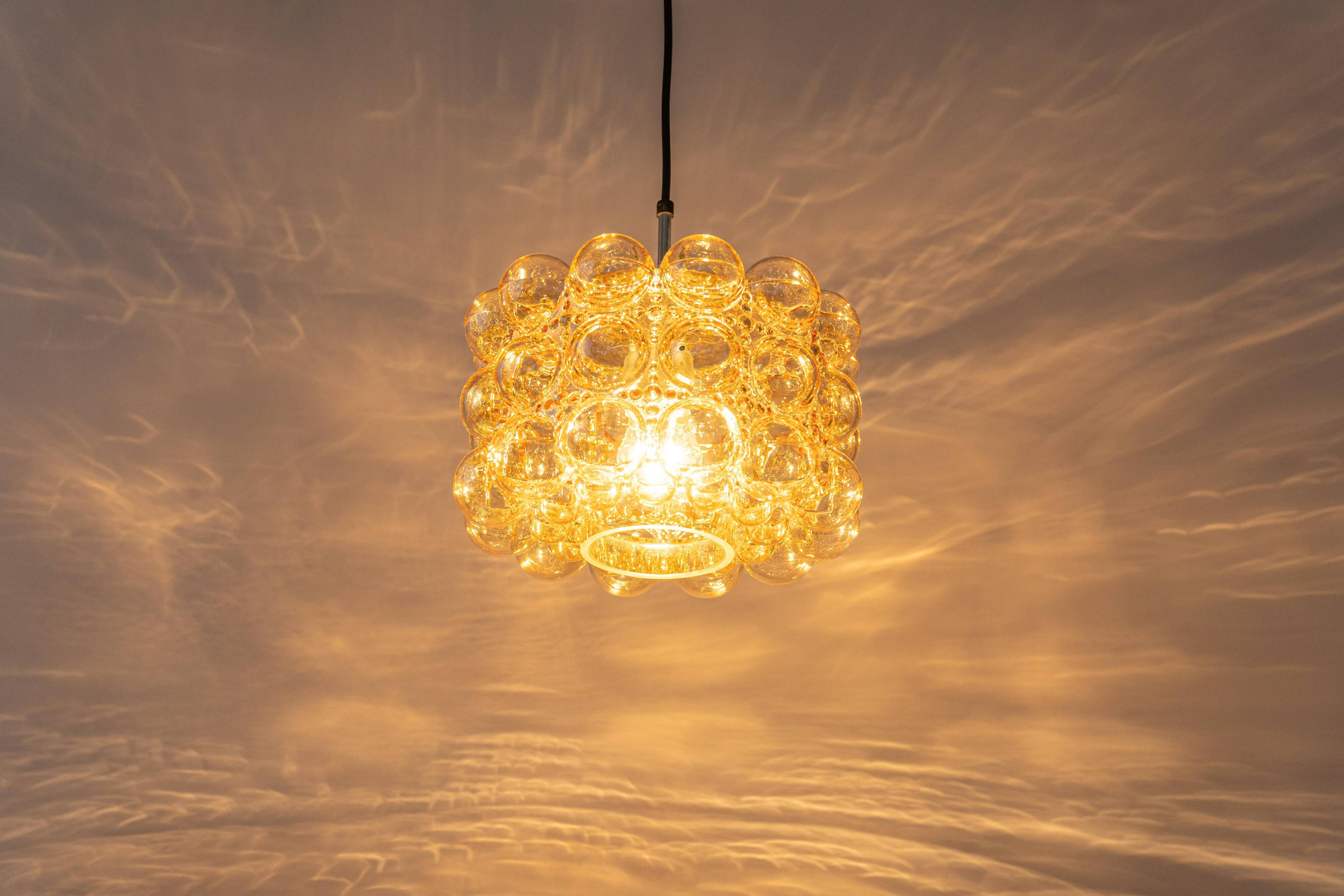 Large amber bubble glass pendant light by Helena Tynell for Limburg, Germany, 1970s.