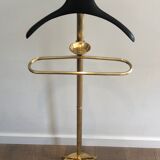 Neoclassical style valet stand in brass and black lacquered wood. French work. Circa 1940