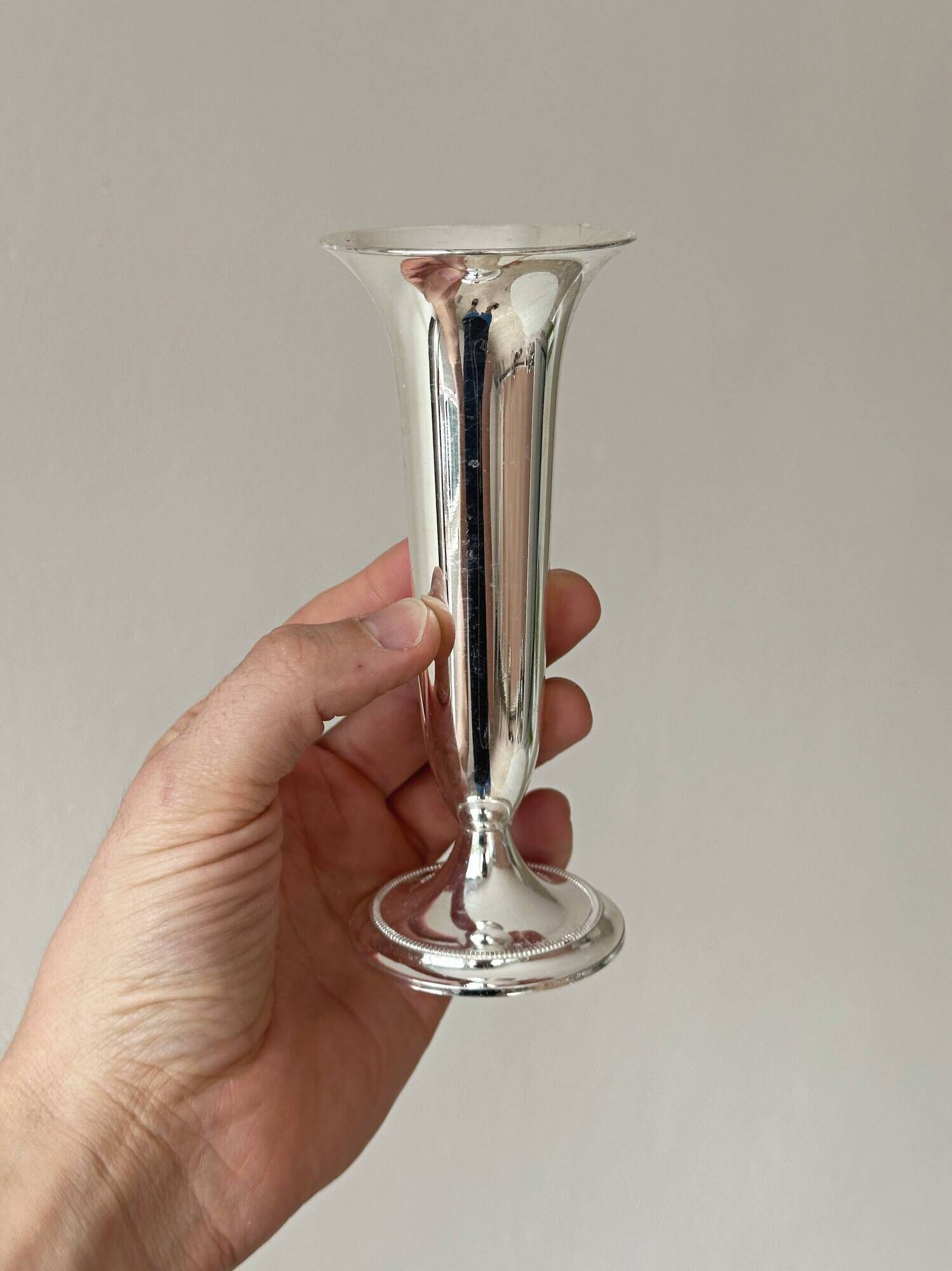 Light silver metal single-stem vase