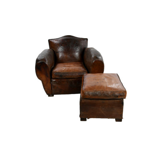 Club armchair and leather ottoman