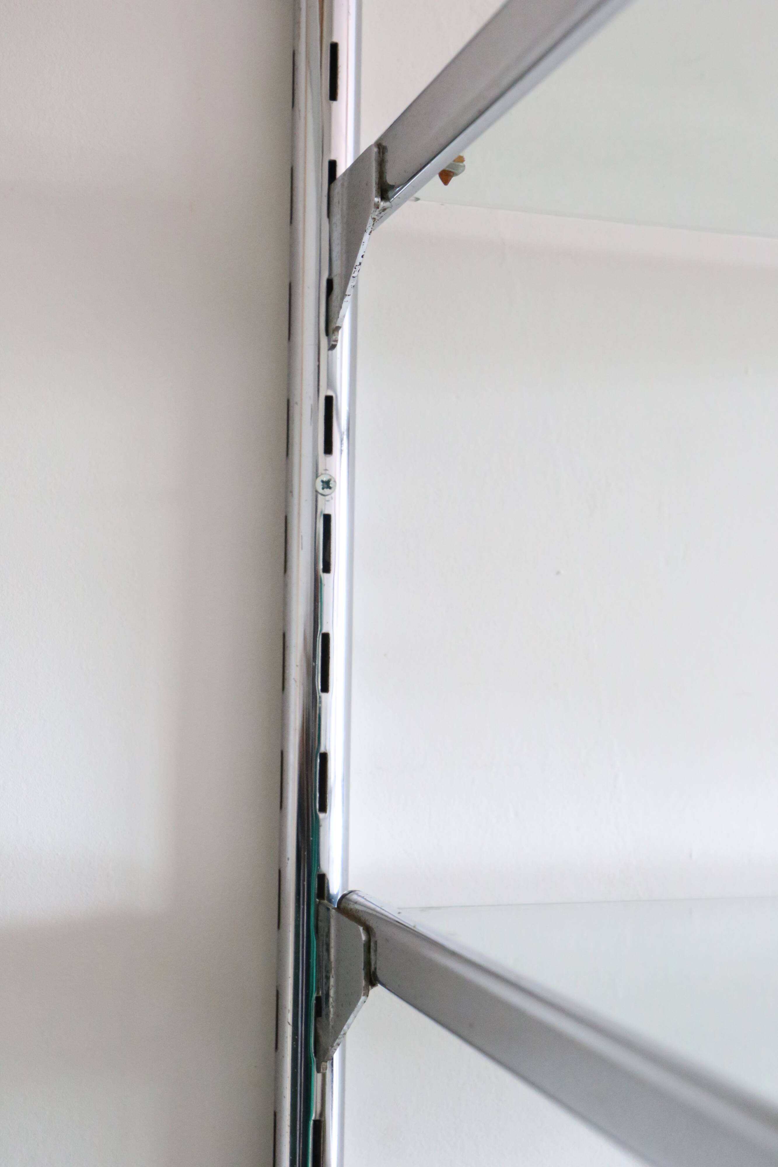 Chrome and glass wall shelf, circa 1960