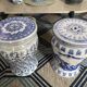 Set of two white and blue porcelain side tables.