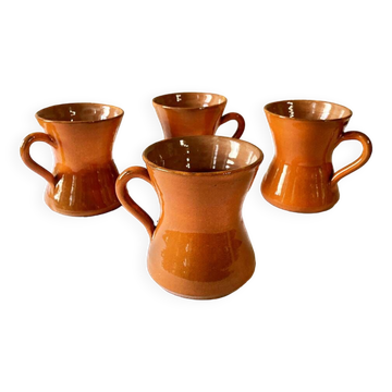 4 large orange enameled ceramic cups, signed