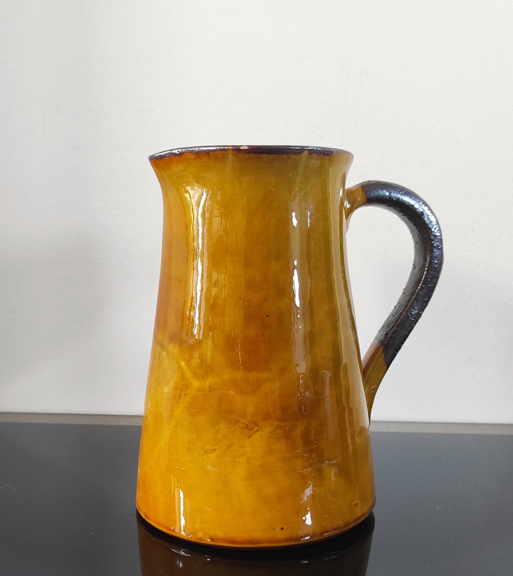 Vintage glazed terracotta pitcher