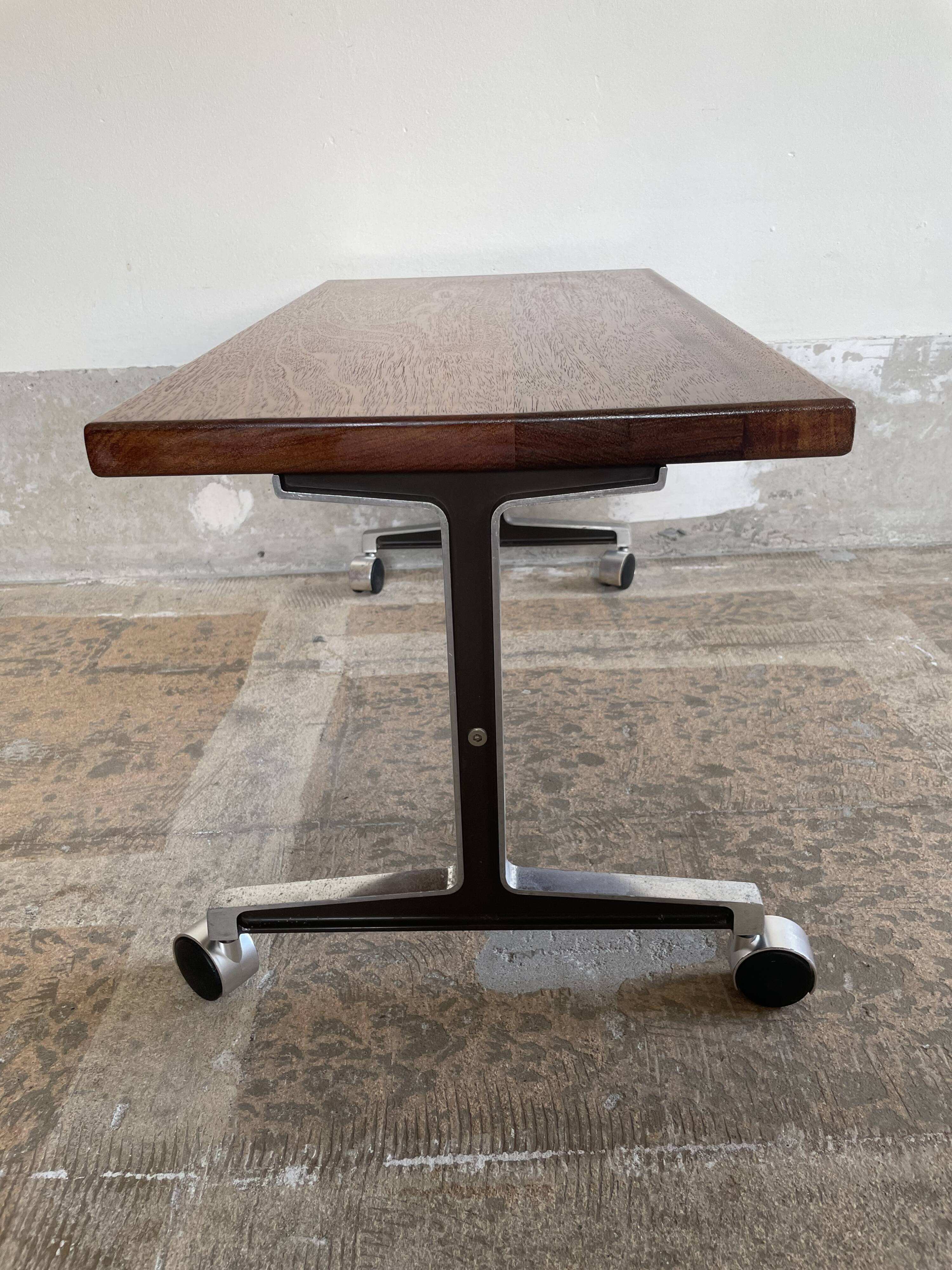 Wooden side table with chrome frame on wheels