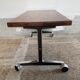 Wooden side table with chrome frame on wheels