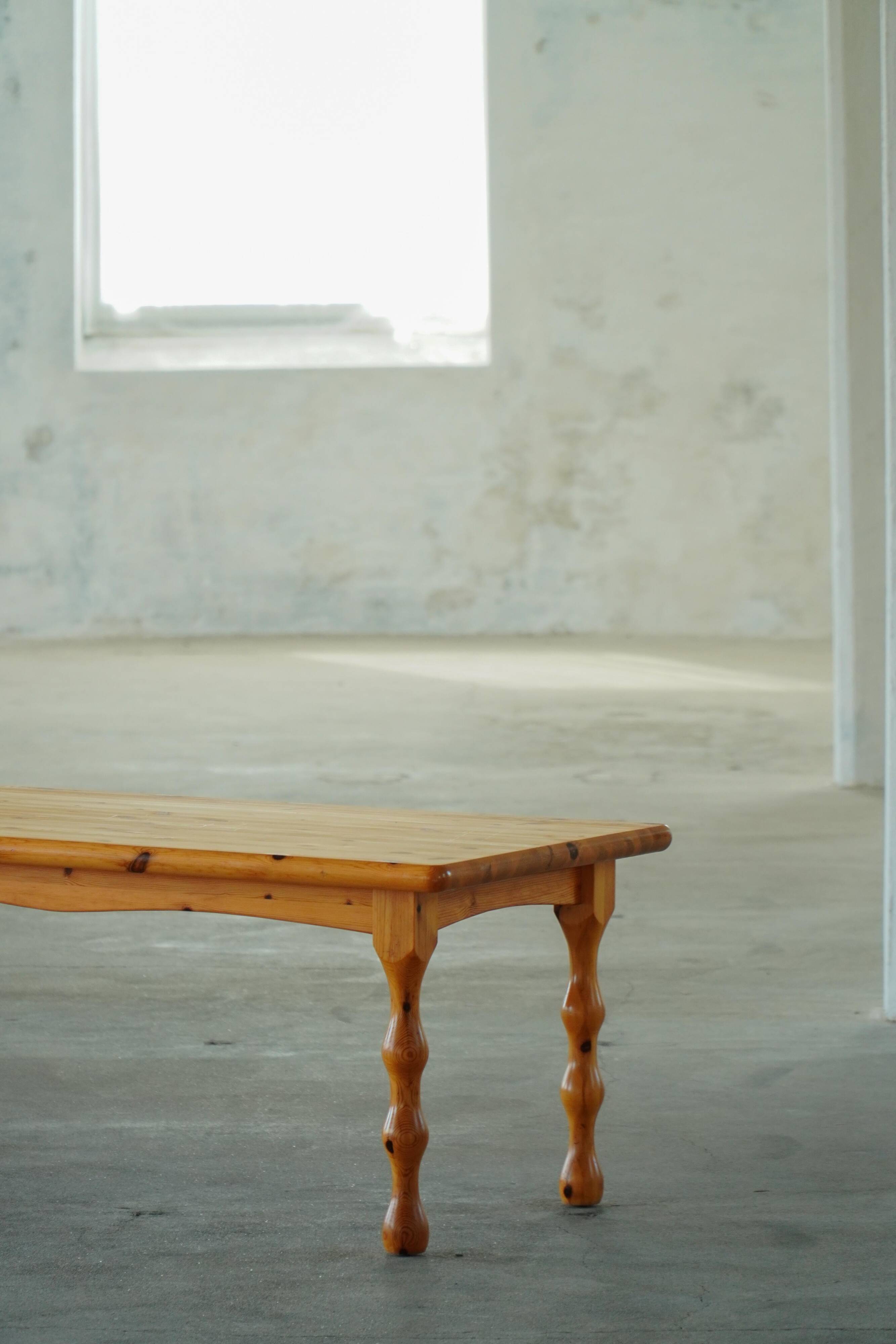 Scandinavian coffee table in brutalist style made of pine, with turned legs, Danish modern style, 1970s.