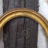 Golden oval frame